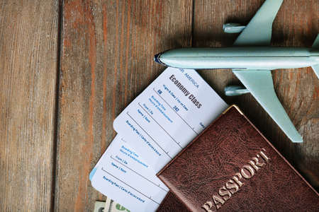 Airline tickets and documents on wooden table, top viewの写真素材