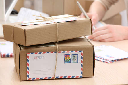 Cardboard boxes on work place in post officeの写真素材