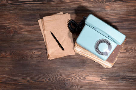 Retro red telephone on table close-upの写真素材