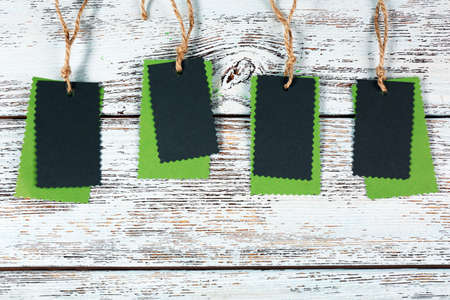 Blank tags on wooden backgroundの写真素材