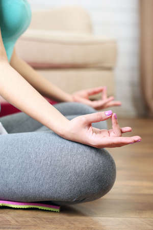 Hand yoga gesture on bright backgroundの写真素材