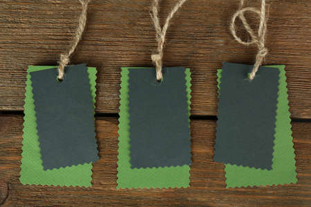 Blank tags on wooden backgroundの写真素材