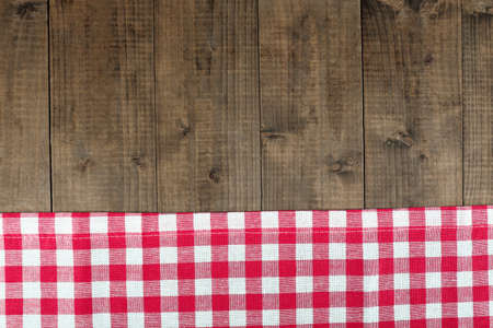 Checkered napkin on wooden table backgroundの写真素材