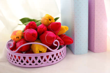 Still life with bouquet of fresh tulips on windowsill backgroundの写真素材