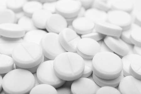 Pile of white pills, closeupの写真素材