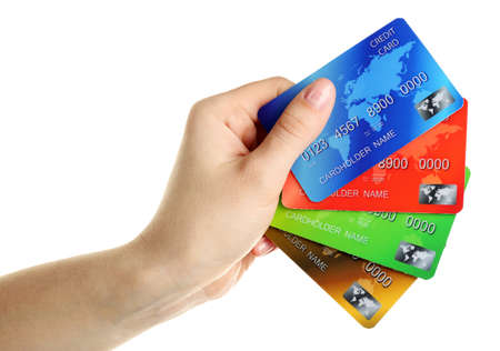 Hand holding credit cards, isolated on whiteの写真素材