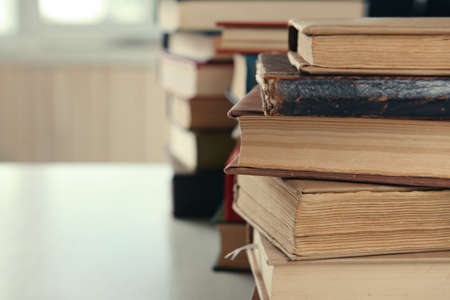 Stacks of books on table close upの写真素材