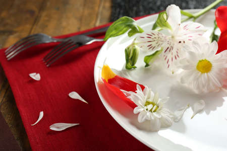 Tableware with flowers on table close upの写真素材