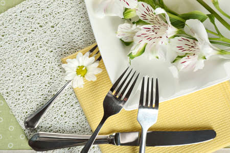 Tableware with flowers on table close upの写真素材