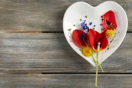 Tableware with flowers on table close upの写真素材