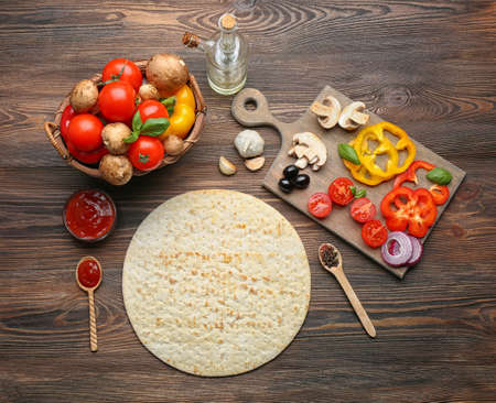 Ingredients for cooking pizza on wooden table, top viewの写真素材