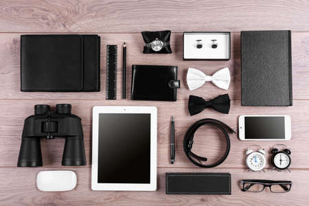 Set of black and white accessories on wooden table, top viewの写真素材
