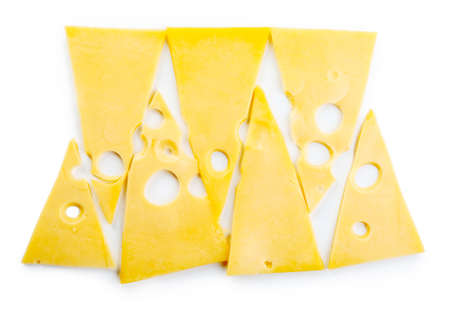 Slices of cheese isolated on whiteの写真素材