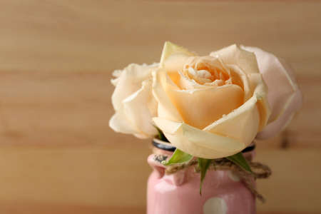 Fresh roses on  wooden background. Vintage conceptの写真素材