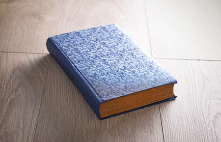 Old book on wooden backgroundの写真素材