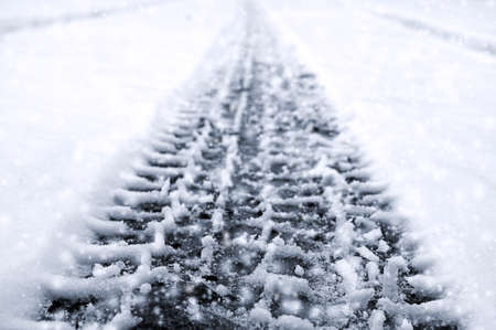 Car tire on winter roadの写真素材