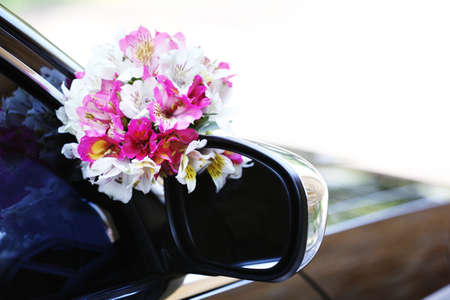 Beautiful flowers on wedding carの写真素材