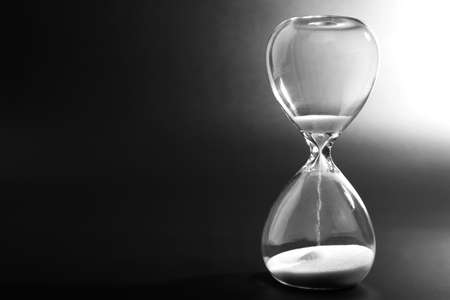 Hourglass on dark backgroundの写真素材