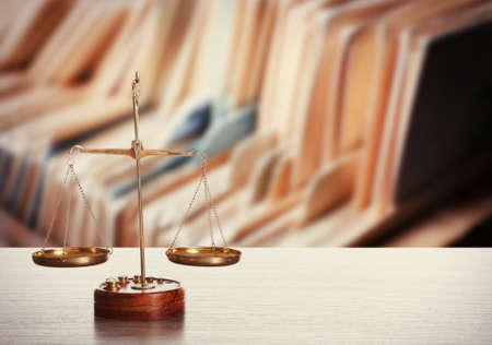 Scales on table in library. Law conceptの写真素材
