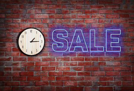 Sale concept. Clock on brick wall backgroundの写真素材