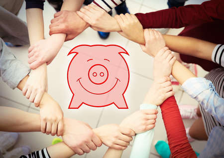 Group of people hands together and virtual piggy bankの写真素材