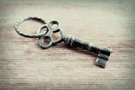 Old key on wooden backgroundの写真素材