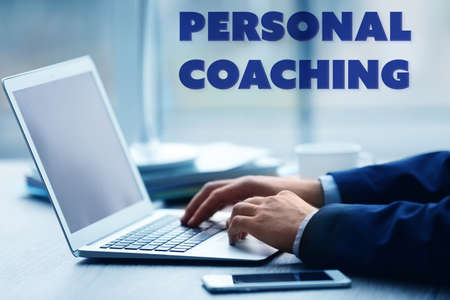 Personal coaching concept. Man's hands using laptop at the tableの写真素材
