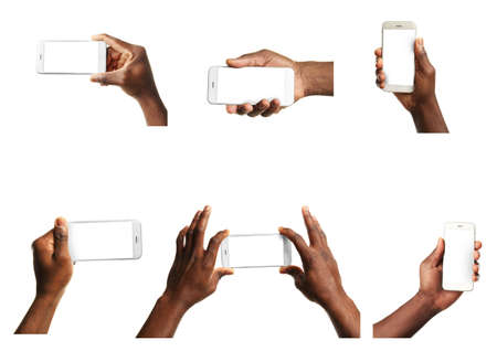 Male hands holding mobile smart phone and tablet with blank screen, isolated on white.の写真素材