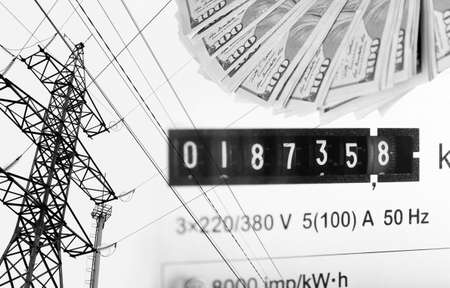 High voltage tower lines, electric meter display and american dollars.の写真素材