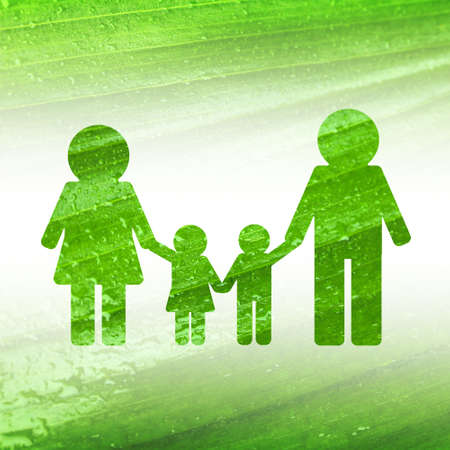 Silhouette of family on green leaf texture background.の写真素材