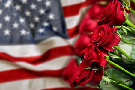 Roses on USA flag background. Symbol of Americaの写真素材
