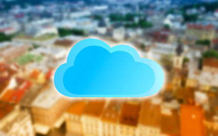 Cloud icon on blurred cityscape background. Modern technology conceptの写真素材