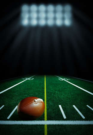 Illuminated football field at nightの写真素材