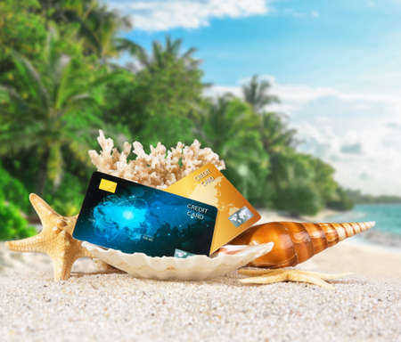 Composition with credit cards on tropical beachの写真素材