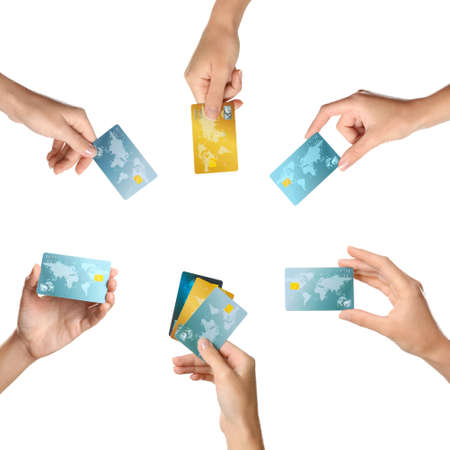 Women holding credit cards on white backgroundの写真素材