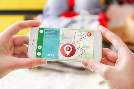 Woman using smartphone. Map application conceptの写真素材