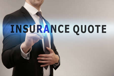 Insurance quote concept. Man working with virtual screenの写真素材