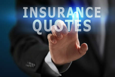 Insurance quotes concept. Man working with virtual screenの写真素材