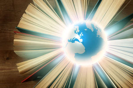 Globe and books on wooden background. World literature conceptの写真素材