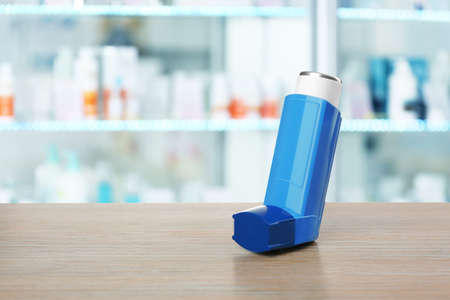 Concept of health care and asthma. Inhaler on counter at pharmacy