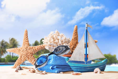 Composition with beach accessories on sea shore. Summer vacation conceptの写真素材