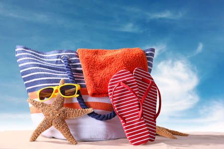 Beach accessories on sea shore. Summer vacation conceptの写真素材