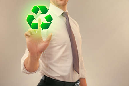 Man showing sign of recycling on virtual screen. Ecology and environment conservationの写真素材