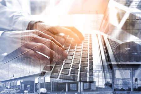 Concept of consulting. Double exposure of cityscape and businessman working with laptopの写真素材