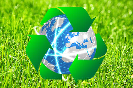 Globe with sign of recycling and grass on background. Ecology and environment conservationの写真素材