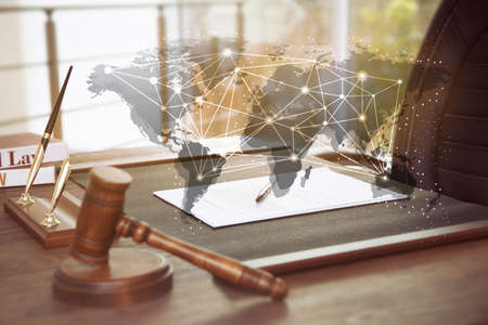 Concept of consulting. World map and judge's workplace on backgroundの写真素材