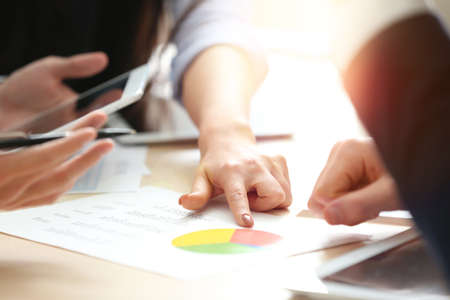 Group of business people working with documents in officeの写真素材