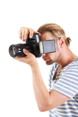 Handsome photographer with camera, isolated on whiteの写真素材