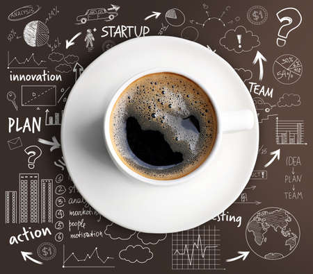 Cup of hot coffee and sketches of business ideas on brown backgroundの写真素材