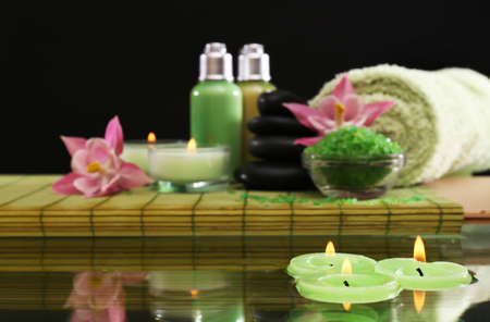 Spa still life with flowers and candlelight on black backgroundの写真素材